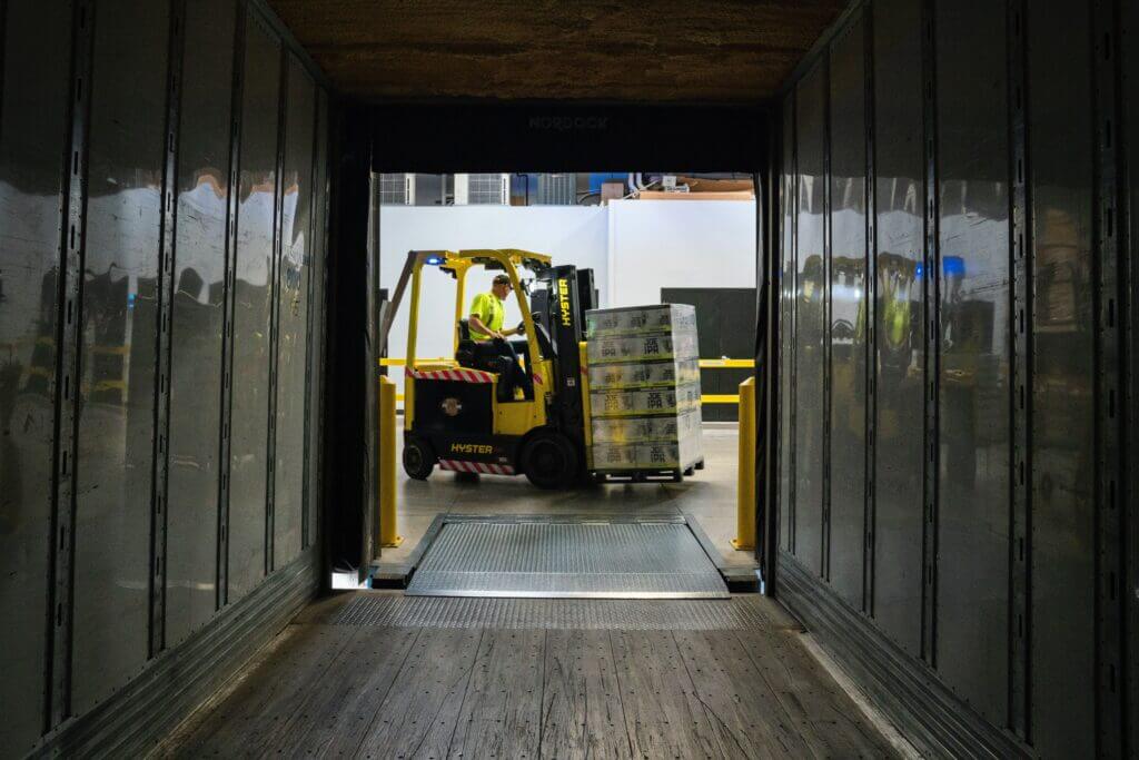 forklift lifting heavy boxes